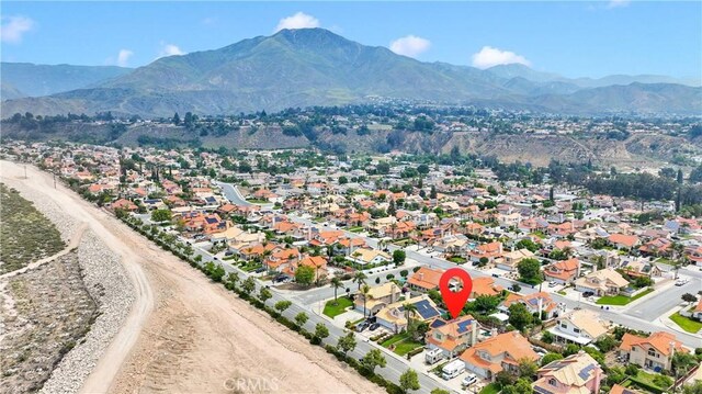 7223 Yarnell Rd, Highland, CA 92346 - aerial perspective of suburban area with a mountain backdrop