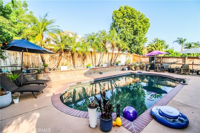 7223 Yarnell Rd, Highland, CA 92346 - view of swimming pool featuring a patio area and a fenced backyard