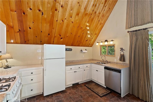 1192 Evergreen Ln, Lake Arrowhead, CA 92352 - kitchen with white appliances, a sink, tile counters, white cabinets, and stone finish flooring