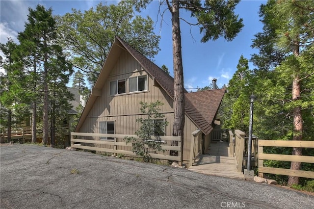 1192 Evergreen Ln, Lake Arrowhead, CA 92352 - view of front of home with roof with shingles, a barn, and an outdoor structure