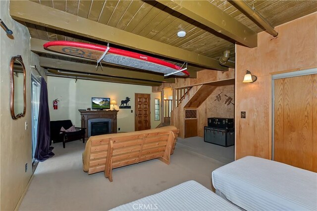 1192 Evergreen Ln, Lake Arrowhead, CA 92352 - bedroom with beamed ceiling and a fireplace