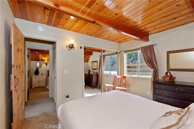 1192 Evergreen Ln, Lake Arrowhead, CA 92352 - bedroom with light colored carpet, wooden ceiling with exposed beams, and a closet