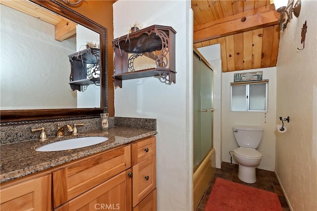 1192 Evergreen Ln, Lake Arrowhead, CA 92352 - bathroom with toilet, vanity, shower / bath combination with glass door, and tile patterned flooring