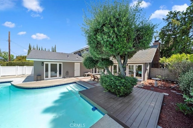 3021 E Hartford Rd, Orange, CA 92869 - back of property featuring french doors, a fenced backyard, and stucco siding