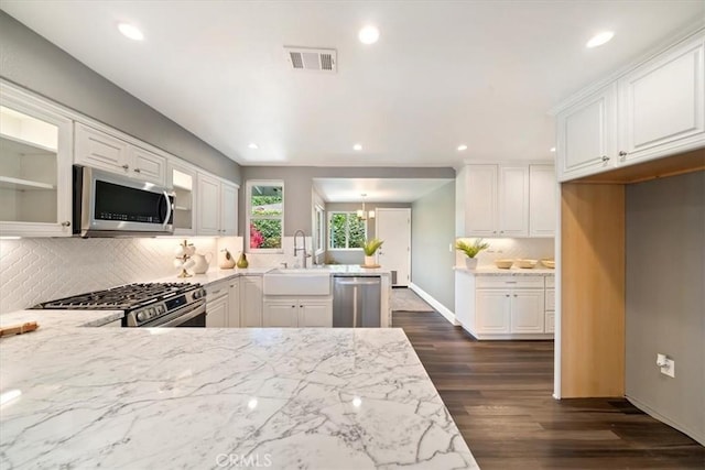 3021 E Hartford Rd, Orange, CA 92869 - kitchen featuring stainless steel appliances, a peninsula, backsplash, recessed lighting, and dark wood-type flooring