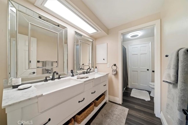 3021 E Hartford Rd, Orange, CA 92869 - bathroom with double vanity, wood finished floors, and a shower with curtain