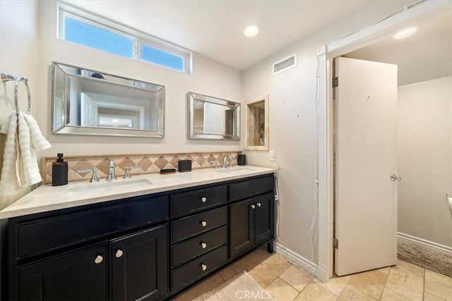3021 E Hartford Rd, Orange, CA 92869 - bathroom featuring double vanity, decorative backsplash, and tile patterned floors