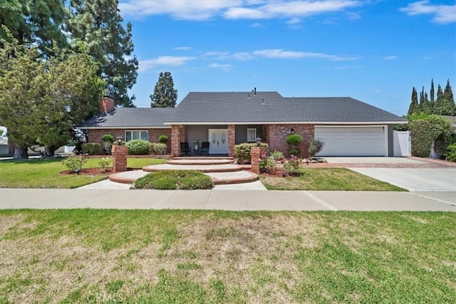 3021 E Hartford Rd, Orange, CA 92869 - single story home with an attached garage, a front yard, concrete driveway, a chimney, and brick siding