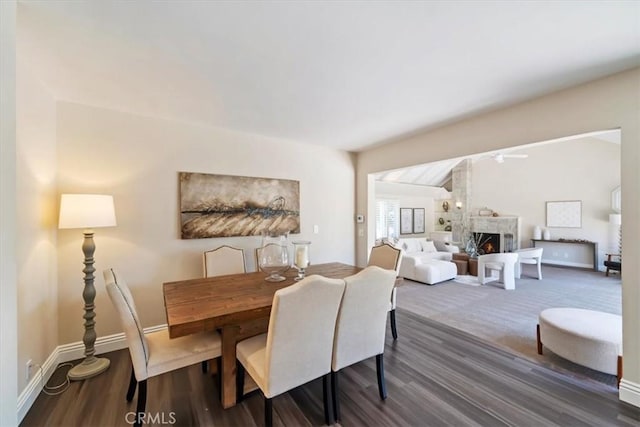 3021 E Hartford Rd, Orange, CA 92869 - dining area featuring a warm lit fireplace, wood finished floors, and ceiling fan