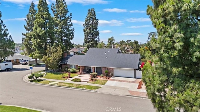 3021 E Hartford Rd, Orange, CA 92869 - view of front of house featuring driveway and an attached garage