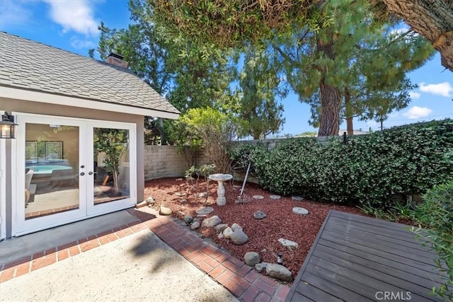 3021 E Hartford Rd, Orange, CA 92869 - fenced backyard with french doors