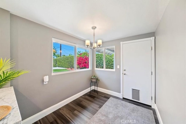 3021 E Hartford Rd, Orange, CA 92869 - entryway with dark wood finished floors and a chandelier
