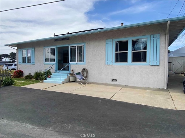201 Old Creek Rd, Cayucos, CA 93430 - rear view of house featuring entry steps, stucco siding, a patio, and crawl space