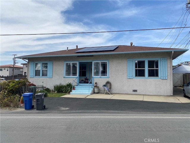 201 Old Creek Rd, Cayucos, CA 93430 - bungalow-style house featuring stucco siding, roof mounted solar panels, and roof with shingles