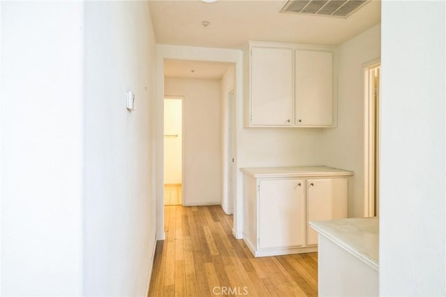 1065 Vaquero Cir, Oxnard, CA 93030 - hallway featuring light wood finished floors and baseboards