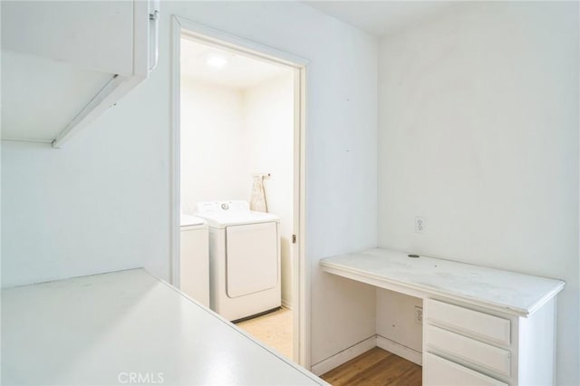 1065 Vaquero Cir, Oxnard, CA 93030 - laundry area featuring washer and dryer, a desk, and light wood-style flooring