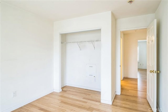 1065 Vaquero Cir, Oxnard, CA 93030 - unfurnished bedroom with light wood finished floors, a closet, and baseboards