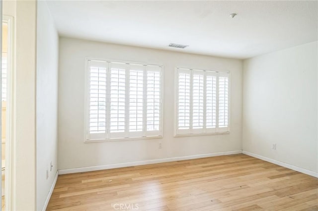 1065 Vaquero Cir, Oxnard, CA 93030 - spare room with wood finished floors, baseboards, and fire sprinkler in ceiling