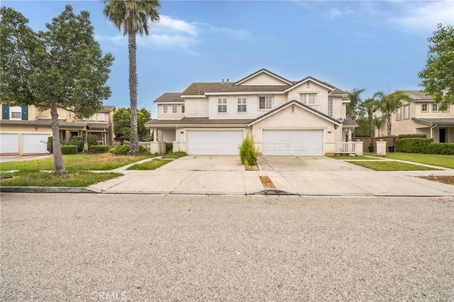1065 Vaquero Cir, Oxnard, CA 93030 - view of front of house with concrete driveway, stucco siding, and a garage