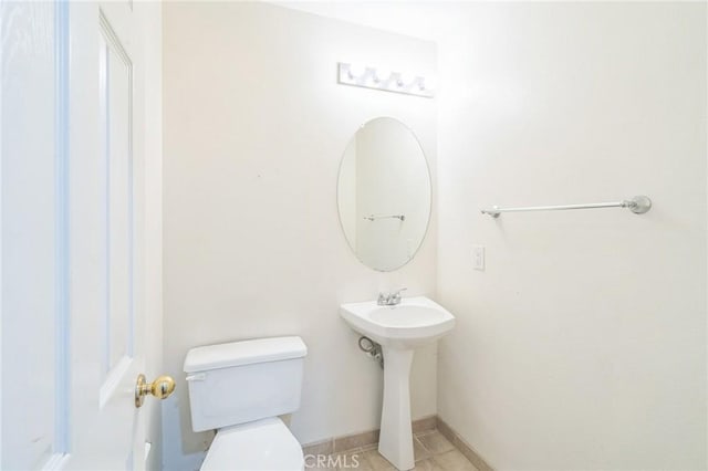 1065 Vaquero Cir, Oxnard, CA 93030 - half bath featuring toilet and baseboards