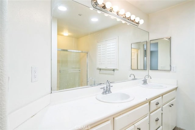 1065 Vaquero Cir, Oxnard, CA 93030 - full bath with double vanity, a shower with door, and recessed lighting