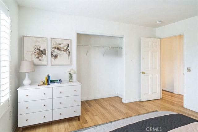1065 Vaquero Cir, Oxnard, CA 93030 - bedroom with light wood-type flooring, a closet, and baseboards