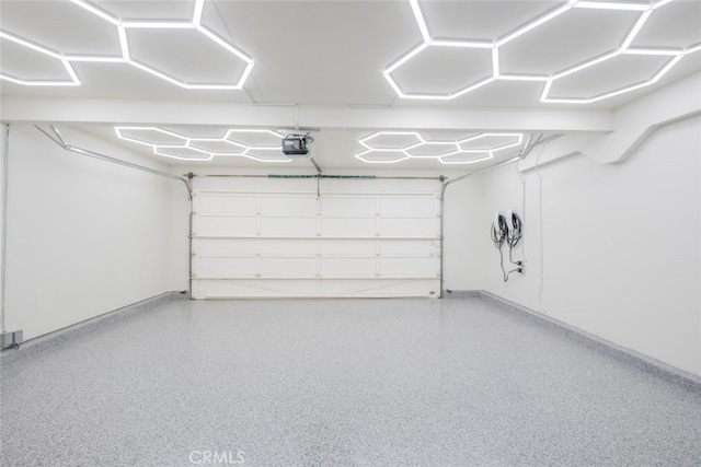 2052 Chenault Pl, Simi Valley, CA 93065 - garage featuring baseboards and a garage door opener