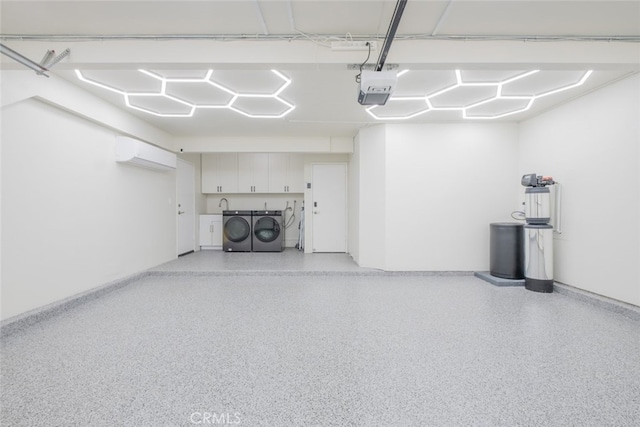 2052 Chenault Pl, Simi Valley, CA 93065 - garage featuring independent washer and dryer, a wall mounted air conditioner, a garage door opener, and baseboards
