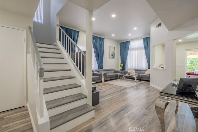2052 Chenault Pl, Simi Valley, CA 93065 - living area with wood finished floors, stairway, and recessed lighting