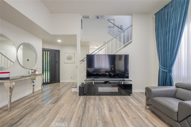2052 Chenault Pl, Simi Valley, CA 93065 - living area featuring stairway, wood finished floors, baseboards, and recessed lighting