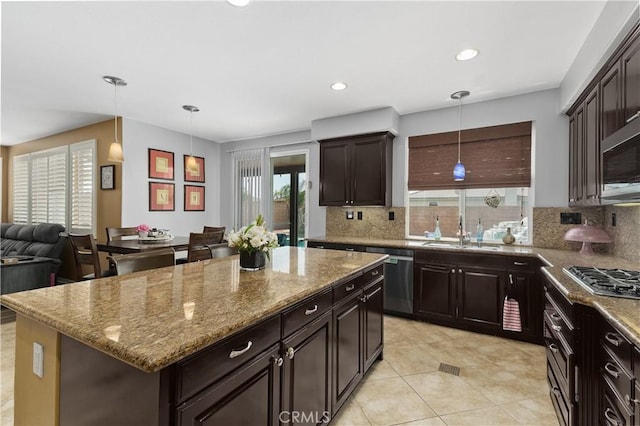 25079 Loring Rd, Wildomar, CA 92595 - kitchen featuring appliances with stainless steel finishes, a sink, backsplash, light stone counters, and recessed lighting