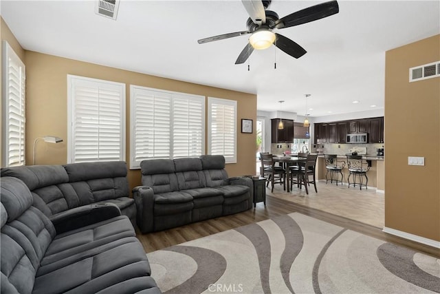 25079 Loring Rd, Wildomar, CA 92595 - living room with light wood finished floors, a ceiling fan, and recessed lighting