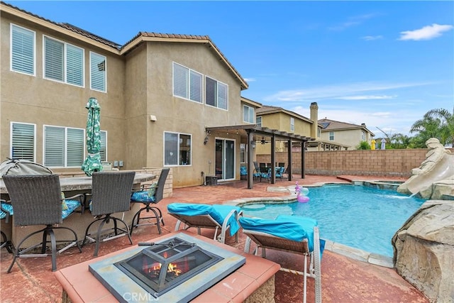 25079 Loring Rd, Wildomar, CA 92595 - view of swimming pool featuring a water slide, an outdoor fire pit, a pergola, and a patio