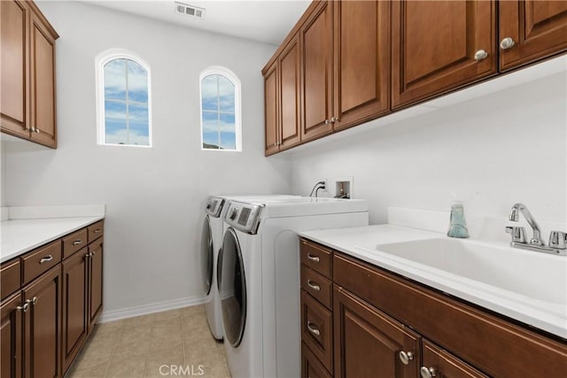 25079 Loring Rd, Wildomar, CA 92595 - laundry area with independent washer and dryer, cabinet space, baseboards, and light tile patterned floors