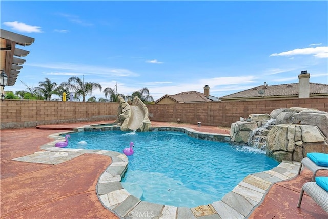 25079 Loring Rd, Wildomar, CA 92595 - view of pool featuring a water slide, a fenced backyard, a pool with connected hot tub, and a patio