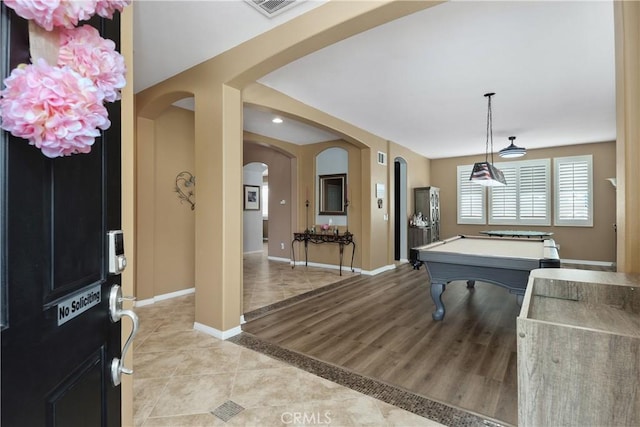 25079 Loring Rd, Wildomar, CA 92595 - playroom featuring arched walkways, billiards table, light tile patterned floors, and baseboards