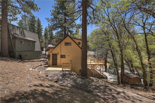 33294 Wild Rose Dr, Green Valley Lake, CA 92341 - view of side of property featuring a wooden deck