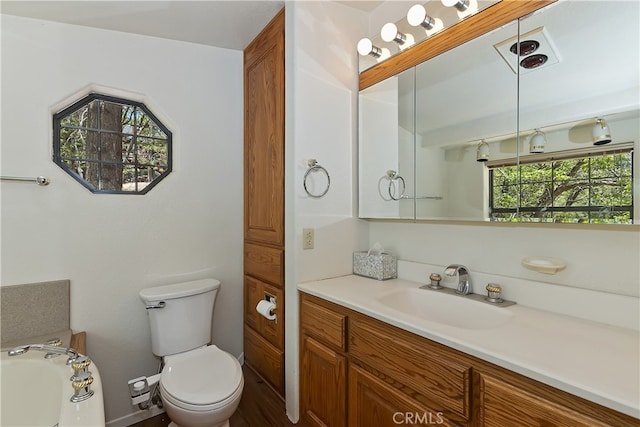 33294 Wild Rose Dr, Green Valley Lake, CA 92341 - bathroom with vanity, toilet, and a tub