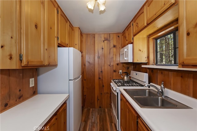 33294 Wild Rose Dr, Green Valley Lake, CA 92341 - kitchen with white appliances, a sink, light countertops, dark wood finished floors, and wood walls