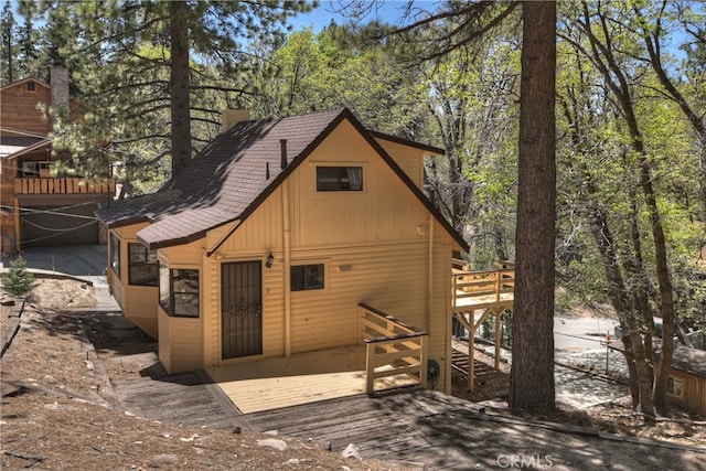 33294 Wild Rose Dr, Green Valley Lake, CA 92341 - back of house featuring a deck and a shingled roof