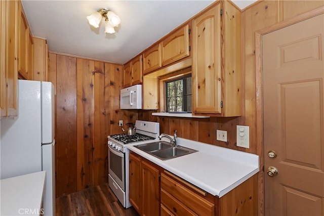 33294 Wild Rose Dr, Green Valley Lake, CA 92341 - kitchen featuring white appliances, a sink, light countertops, dark wood-type flooring, and wooden walls