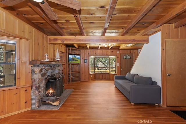33294 Wild Rose Dr, Green Valley Lake, CA 92341 - living room featuring wood walls, wood finished floors, wooden ceiling with exposed beams, and a fireplace