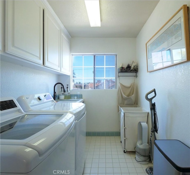 2018 Bataan Rd Unit A, Redondo Beach, CA 90278 - laundry area featuring cabinet space, independent washer and dryer, baseboards, and light tile patterned floors
