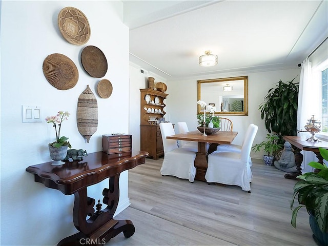 2018 Bataan Rd Unit A, Redondo Beach, CA 90278 - dining area with light wood-style flooring and ornamental molding