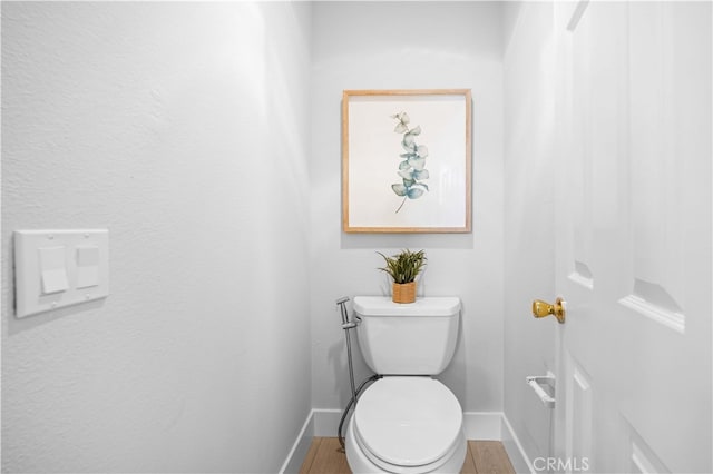 20 Chenile, Irvine, CA 92614 - bathroom featuring baseboards, toilet, and wood finished floors