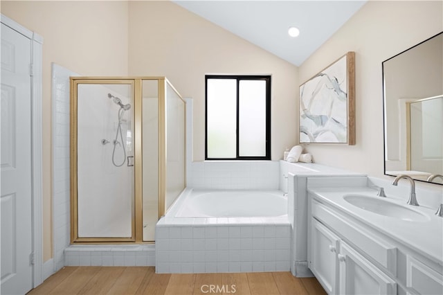 20 Chenile, Irvine, CA 92614 - bathroom with a stall shower, lofted ceiling, a bath, wood finished floors, and vanity