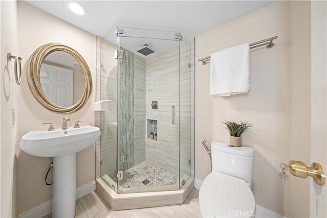 20 Chenile, Irvine, CA 92614 - bathroom with toilet, baseboards, a stall shower, and a sink