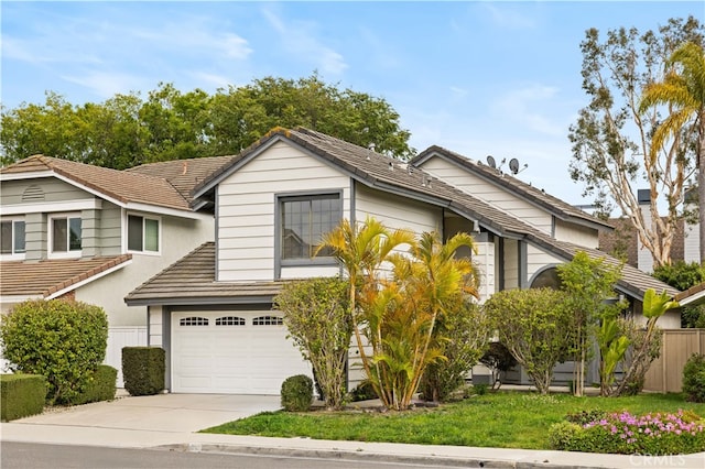 20 Chenile, Irvine, CA 92614 - view of front facade with a tiled roof, a garage, and concrete driveway