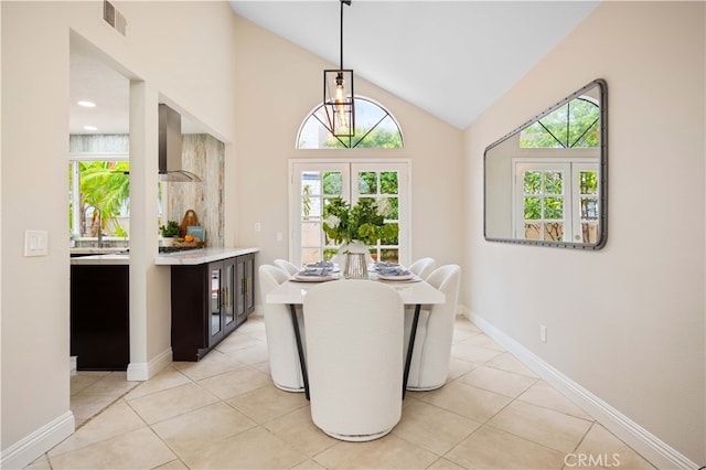 20 Chenile, Irvine, CA 92614 - dining area featuring vaulted ceiling, light tile patterned flooring, and baseboards
