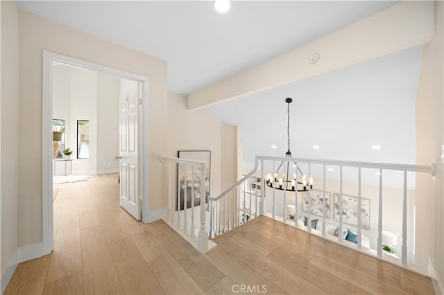 20 Chenile, Irvine, CA 92614 - hall with an upstairs landing, light wood finished floors, a chandelier, recessed lighting, and baseboards